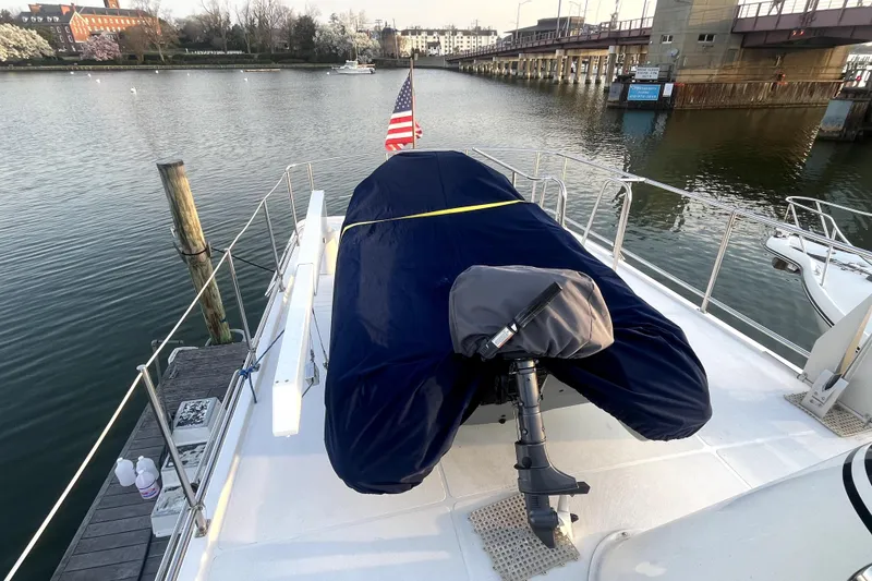 Slide: The Image of Nordic Tug 42 (2008) on deck, covered motor, docked by calm waters. - 60