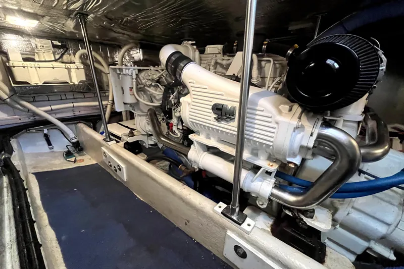 Slide: The Image of Engine room of a 2008 Nordic Tug 42, showcasing a clean, well-maintained engine. - 72