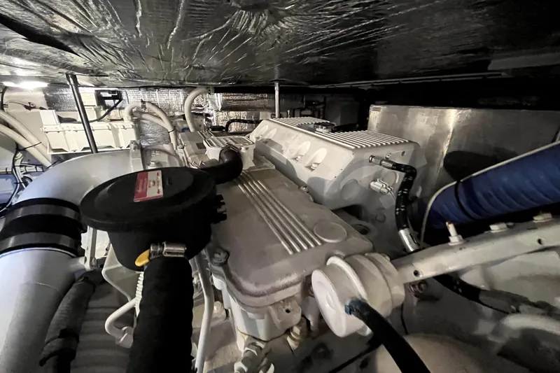Slide: The Image of Engine room of a 2008 Nordic Tug 42, showcasing mechanical components and piping. - 75