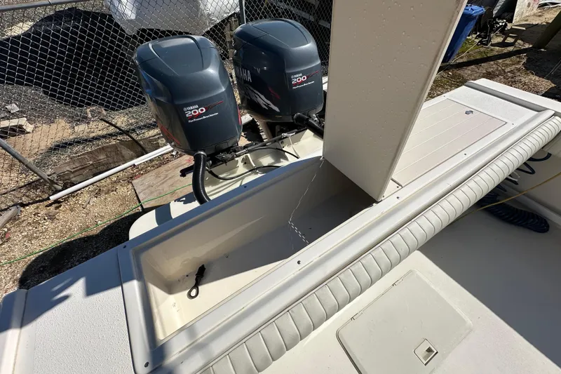 Slide: The Image of 2001 Parker 2510 Deep Vee Walkaround boat with Yamaha 200 engines, open storage compartment. - 10