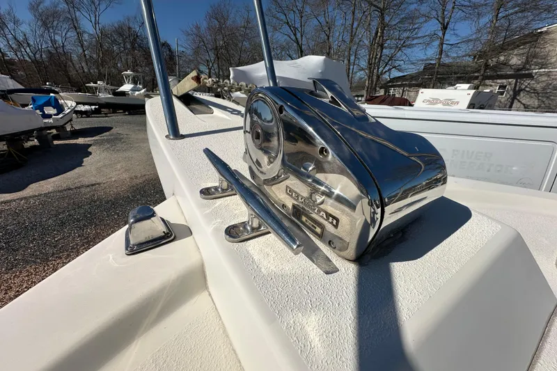 Slide: The Image of 2001 Parker 2510 Deep Vee Walkaround boat with a shiny anchor winch. - 21