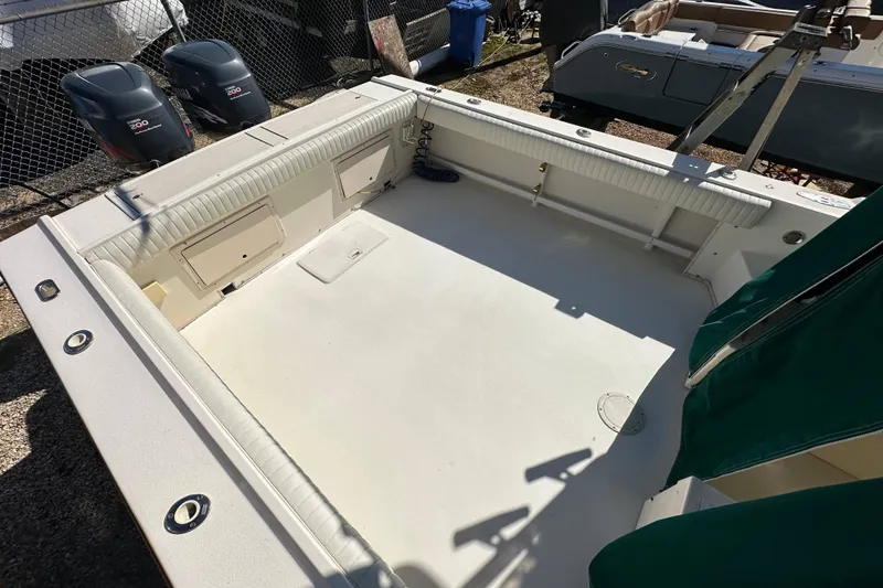 Slide: The Image of 2001 Parker 2510 Deep Vee Walkaround boat deck with twin outboard motors. - 24