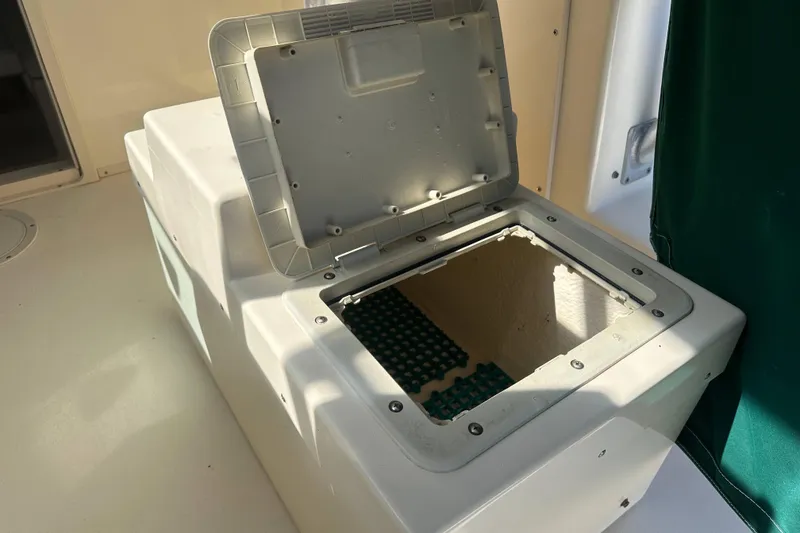 Slide: The Image of Open storage compartment on 2001 Parker 2510 Deep Vee Walkaround boat. - 27