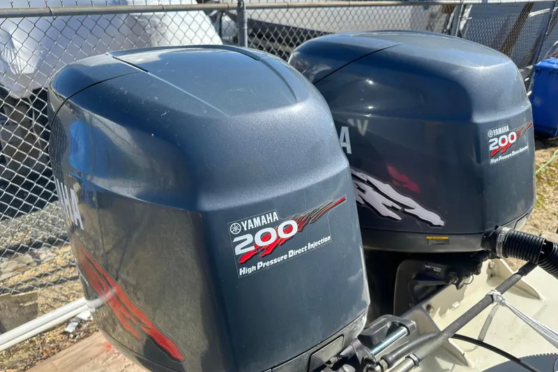 Slide: The Image of Twin Yamaha 200 outboard engines on a 2001 Parker 2510 Deep Vee Walkaround boat. - 29