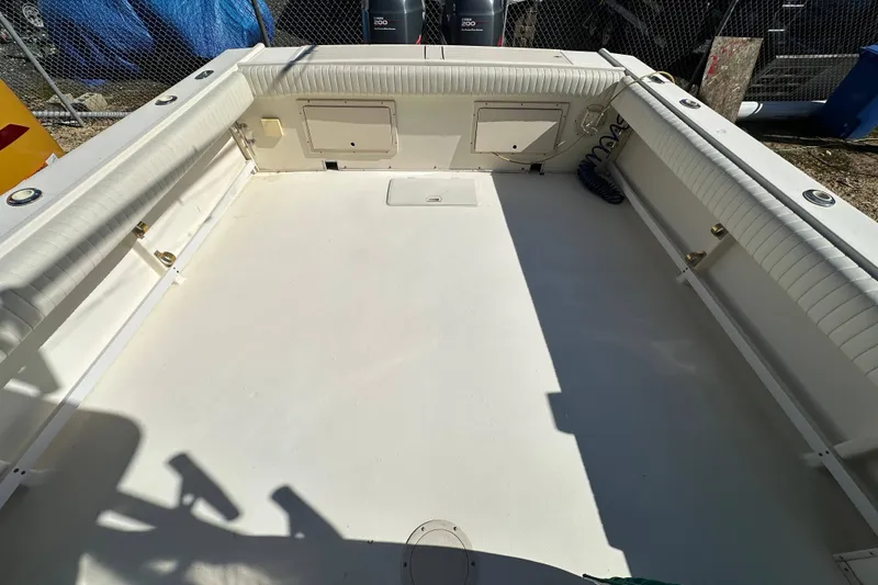 Slide: The Image of 2001 Parker 2510 Deep Vee Walkaround boat deck, spacious and clean layout. - 8