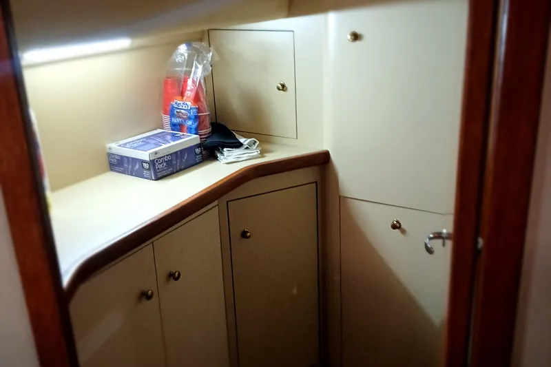 Slide: The Image of Cabin storage area in 2000 Sea Ray 420 Aft Cabin yacht. - 19