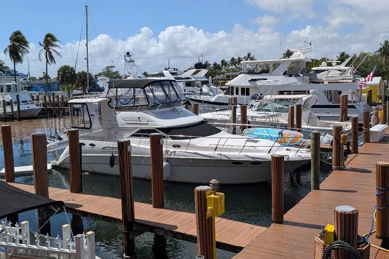 Slide: The Image of 2000 Sea Ray 420 Aft Cabin yacht docked at marina with other boats. - 3