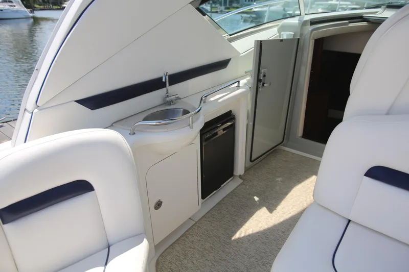 Slide: The Image of Interior of 2010 Sea Ray 390 Sundancer yacht with sink and seating area. - 14