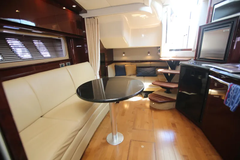 Slide: The Image of Luxurious interior of 2010 Sea Ray 390 Sundancer yacht with elegant seating and modern amenities. - 19