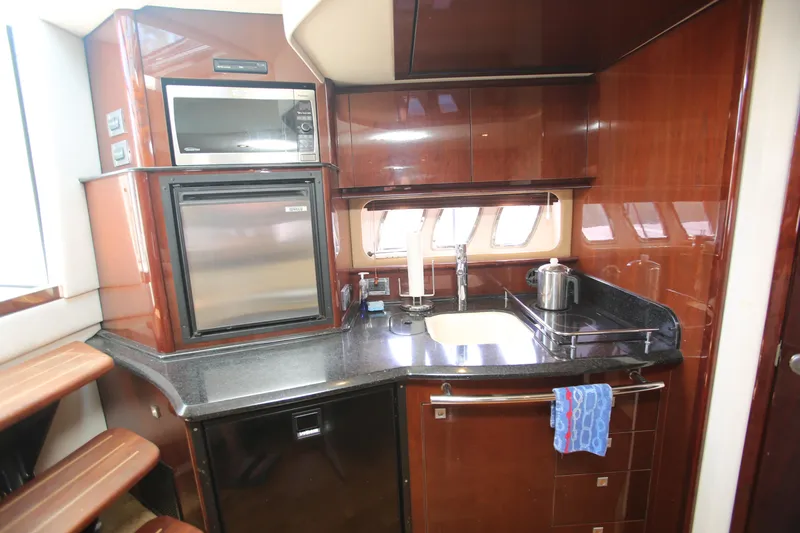 Slide: The Image of Luxurious kitchen area in 2010 Sea Ray 390 Sundancer yacht with modern appliances. - 25