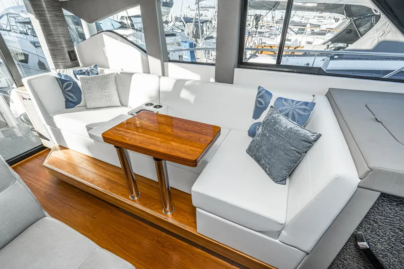 Slide: The Image of Interior of 2020 Tiara Yachts C39 Coupe with elegant seating area. - 16