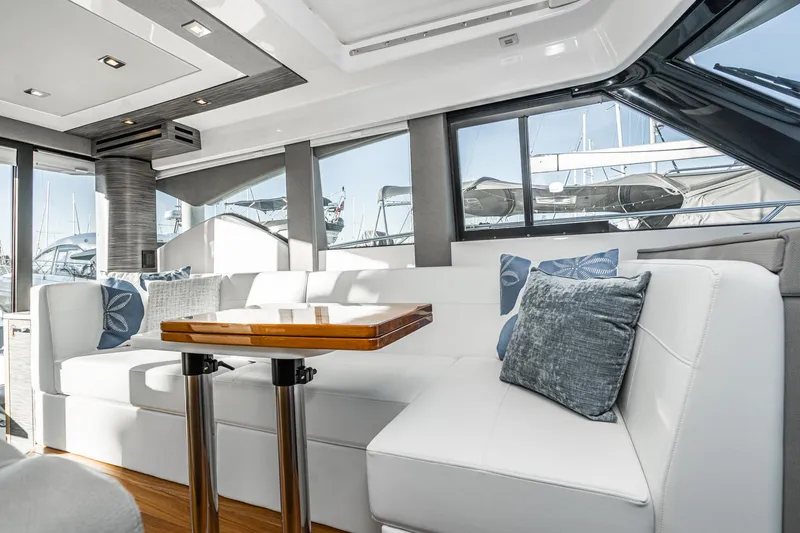 Slide: The Image of Interior of 2020 Tiara Yachts C39 Coupe with elegant white upholstery. - 17
