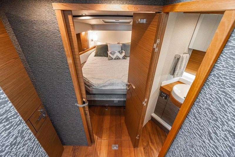 Slide: The Image of Interior of 2020 Tiara Yachts C39 Coupe featuring bedroom and bathroom. - 25