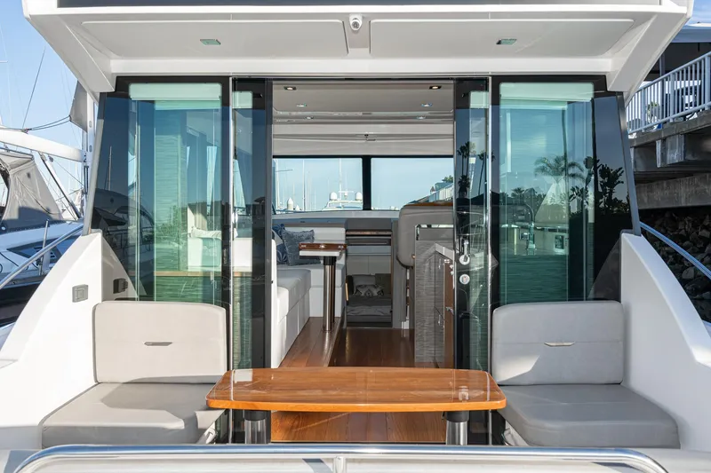 Slide: The Image of 2020 Tiara Yachts C39 Coupe interior view with seating and table. - 6