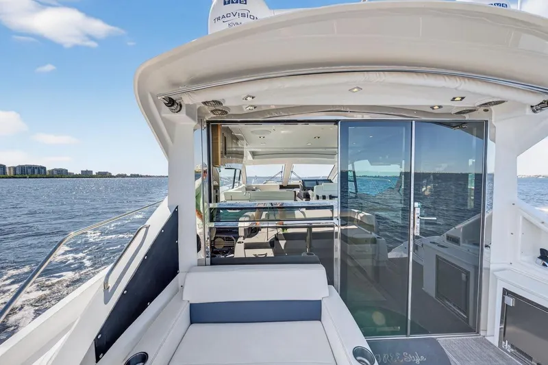 Slide: The Image of 2020 Cruisers Yachts 50 Cantius on water, showcasing luxurious interior and sleek design. - 17