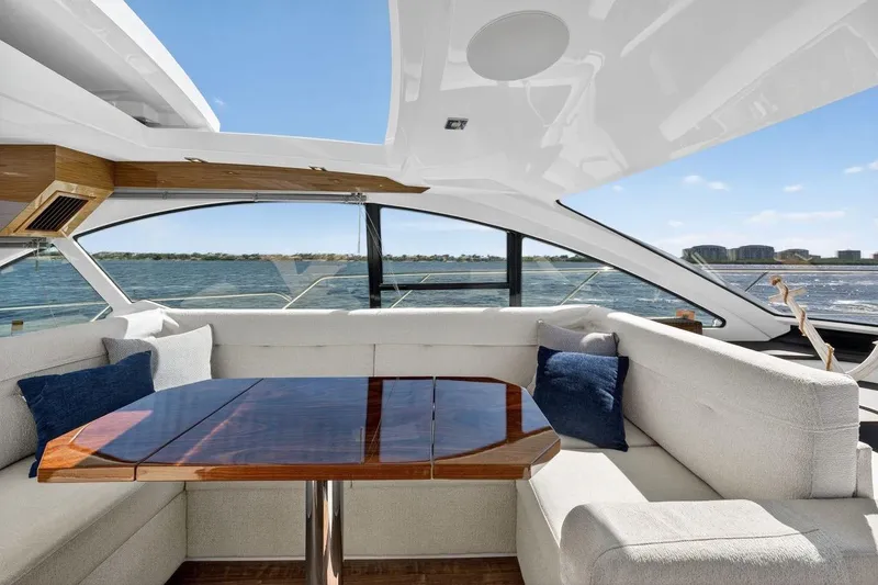 Slide: The Image of Luxurious interior of 2020 Cruisers Yachts 50 Cantius with elegant seating and ocean view. - 32