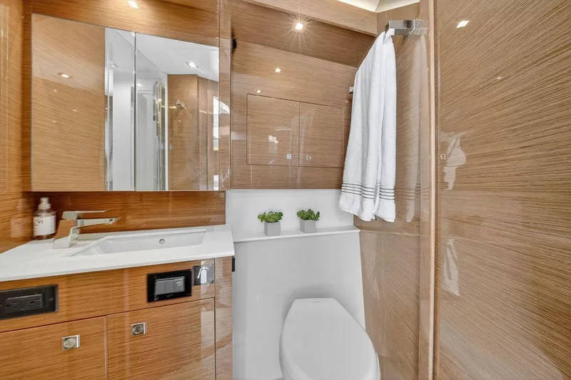 Slide: The Image of Luxurious bathroom in 2020 Cruisers Yachts 50 Cantius, featuring modern fixtures and elegant wood finishes. - 37