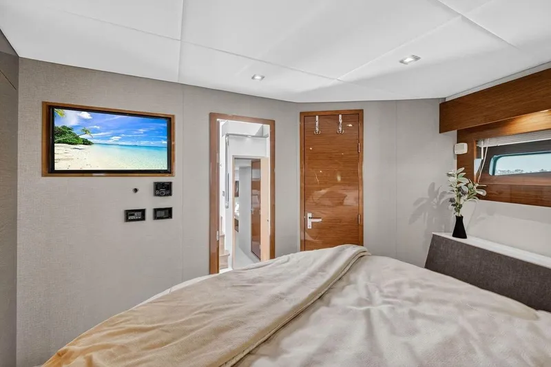 Slide: The Image of Luxurious 2020 Cruisers Yachts 50 Cantius bedroom with modern decor and scenic view. - 41