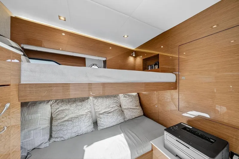 Slide: The Image of Luxurious 2020 Cruisers Yachts 50 Cantius cabin with modern wood finish and cozy bedding. - 42