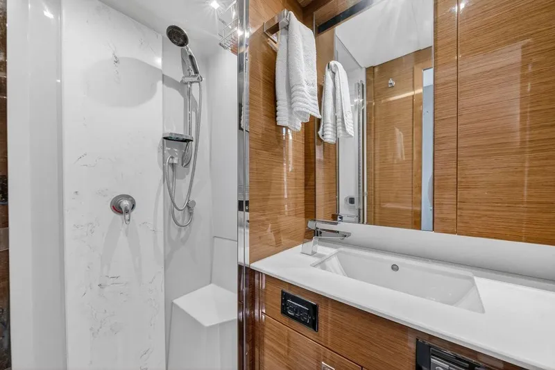 Slide: The Image of Luxurious bathroom in 2020 Cruisers Yachts 50 Cantius, featuring modern shower and sleek vanity. - 48