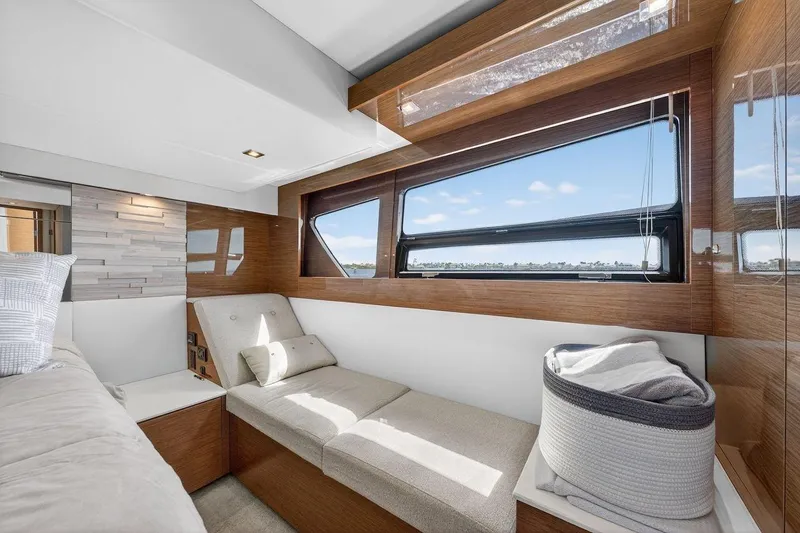 Slide: The Image of Luxurious interior of 2020 Cruisers Yachts 50 Cantius with modern seating and large window view. - 54