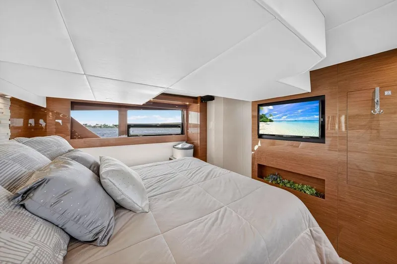 Slide: The Image of Luxurious bedroom interior of 2020 Cruisers Yachts 50 Cantius with scenic window view. - 56