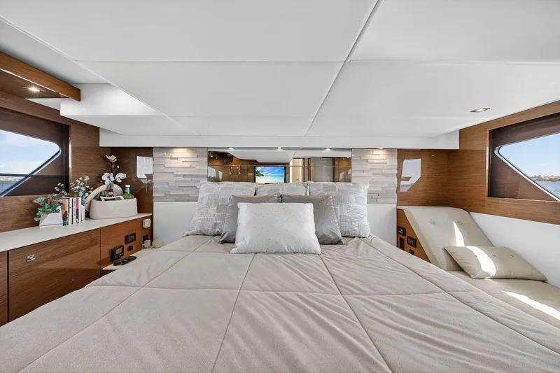 Slide: The Image of Luxurious bedroom interior of 2020 Cruisers Yachts 50 Cantius with modern decor and large windows. - 58