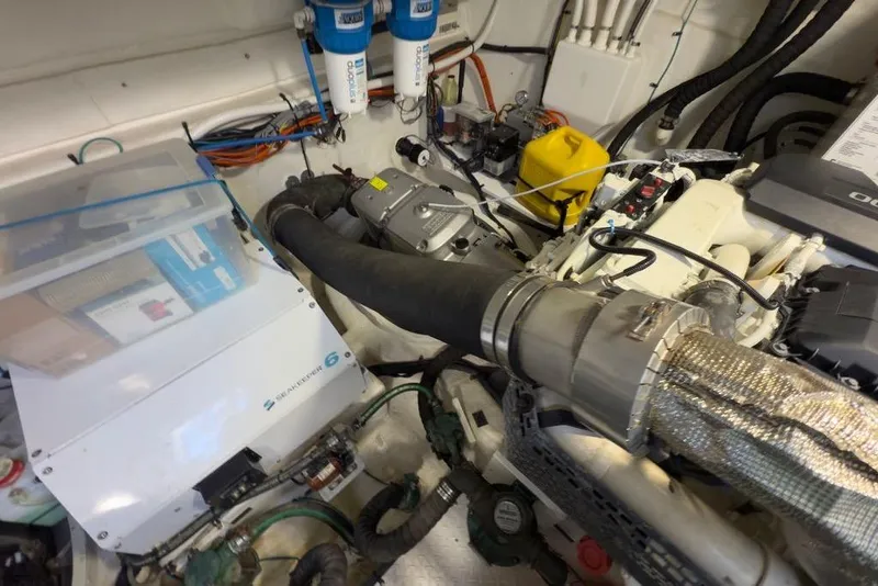 Slide: The Image of Engine room of 2020 Cruisers Yachts 50 Cantius, showcasing mechanical components and wiring. - 69