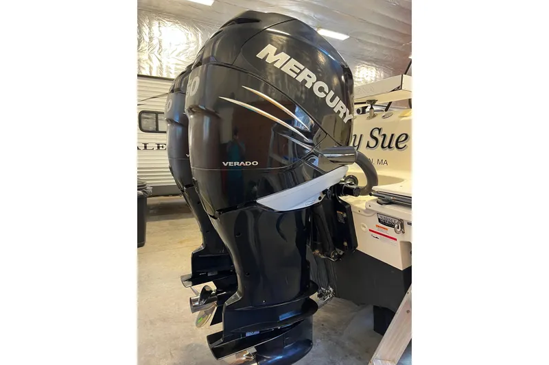 Slide: The Image of 2014 Boston Whaler 280 Outrage with Mercury Verado outboard engines in a garage. - 9