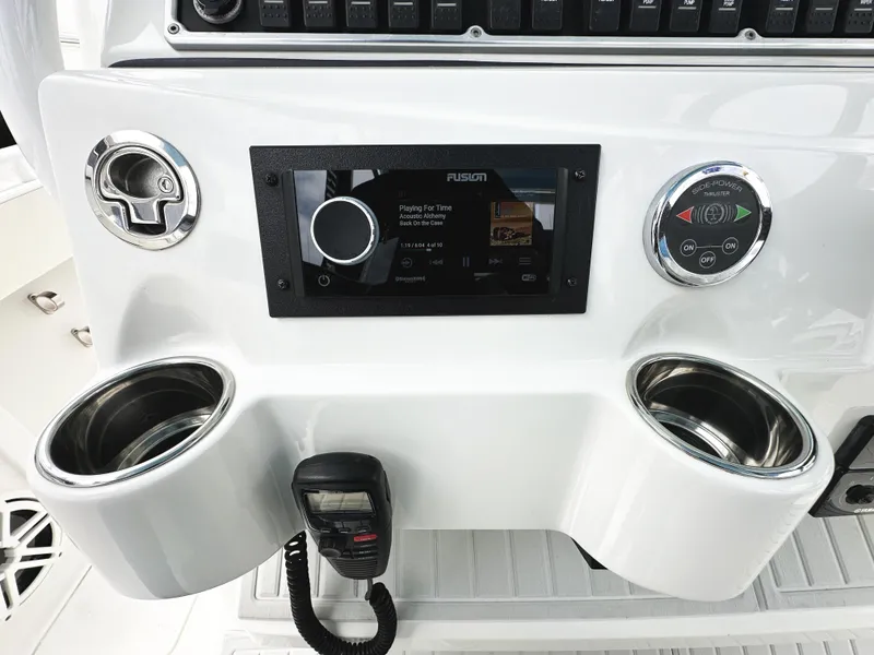 Slide: The Image of Control panel of 2018 HCB 39 Speciale boat with stereo and cup holders. - 24