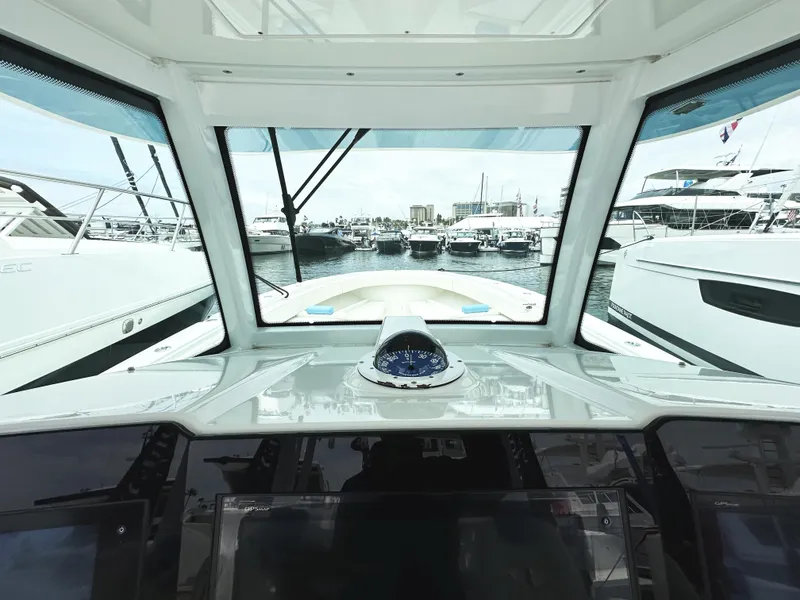 Slide: The Image of Interior view of 2018 HCB 39 Speciale boat cockpit with marina in background. - 25