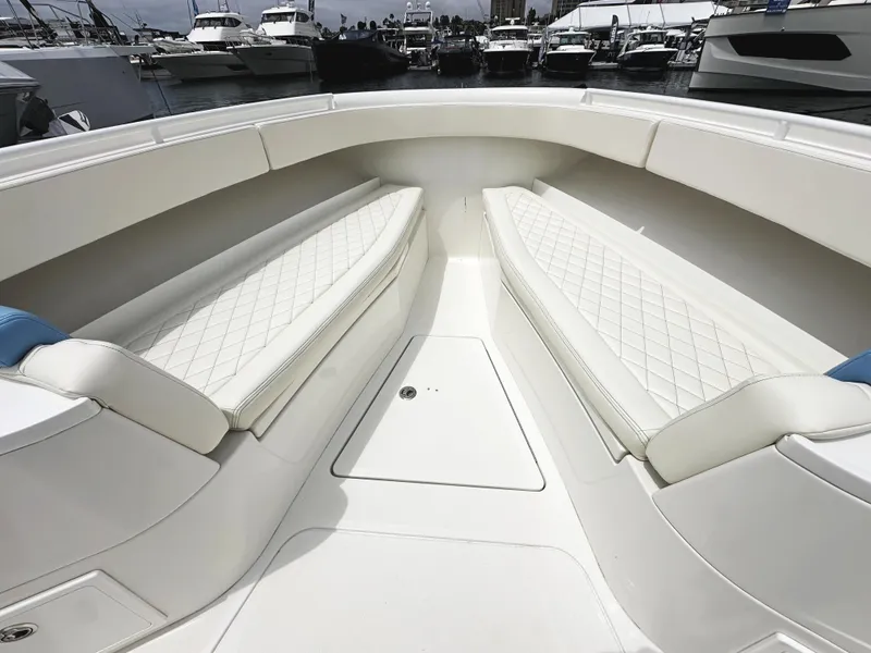 Slide: The Image of 2018 HCB 39 Speciale boat interior with white cushioned seating and diamond stitching. - 30