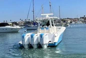 Slide: The Image of 2018 HCB 39 Speciale boat with triple outboard engines in a marina setting. - 5