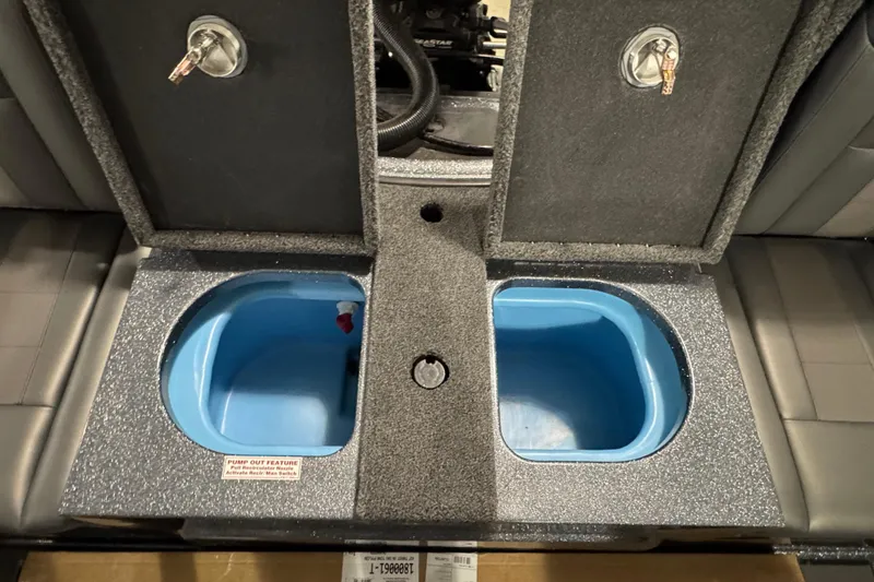 Slide: The Image of Open storage compartments in a 2026 Nitro ZV19 Sport boat interior. - 10