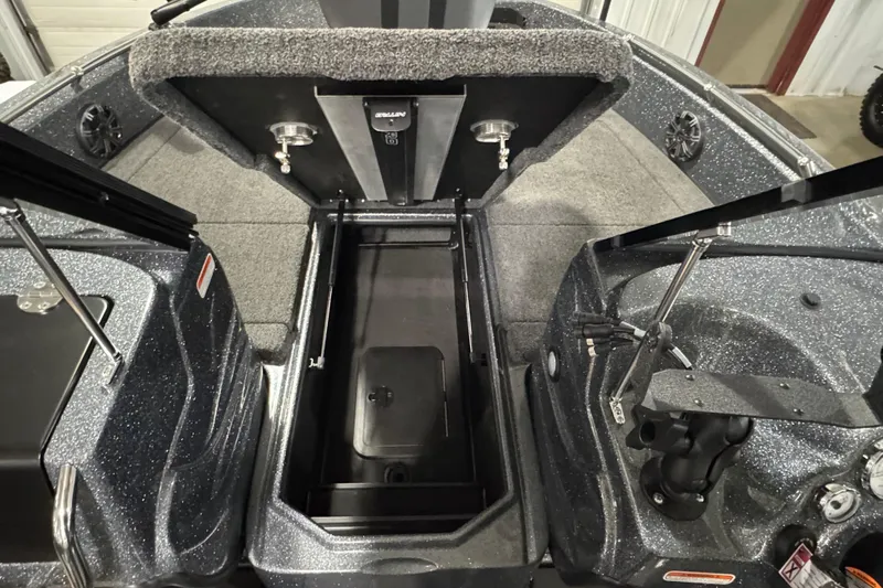 Slide: The Image of 2026 Nitro ZV19 Sport boat interior with open storage compartment and carpeted flooring. - 11