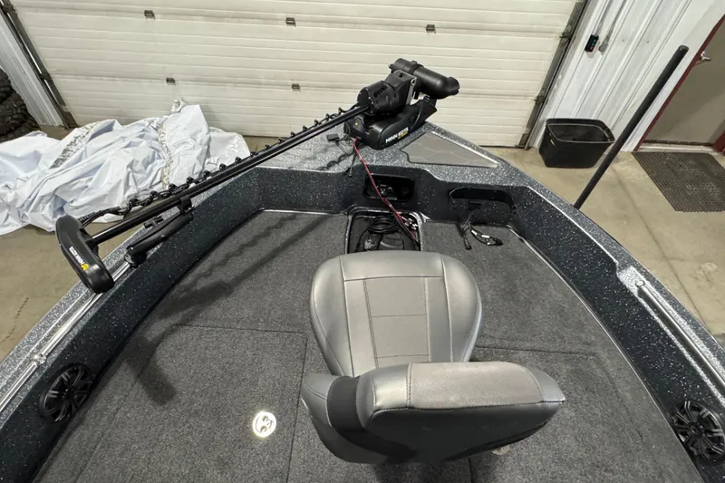 Slide: The Image of 2026 Nitro ZV19 Sport boat interior with trolling motor and seating. - 12