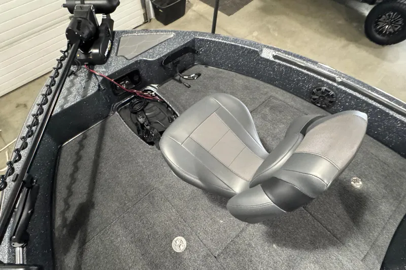 Slide: The Image of 2026 Nitro ZV19 Sport boat interior with gray seating and fishing equipment. - 15