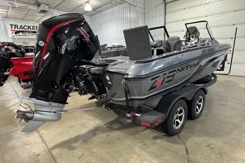 Slide: The Image of 2026 Nitro ZV19 Sport boat with powerful outboard motor in showroom. - 3