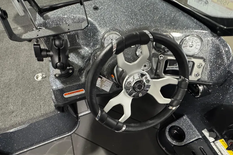 Slide: The Image of Steering wheel and dashboard of 2026 Nitro ZV19 Sport boat, featuring modern controls. - 7