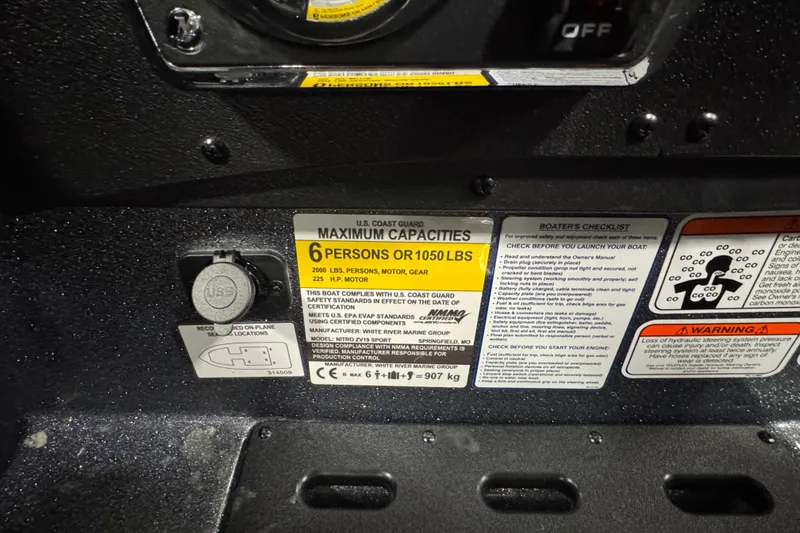 Slide: The Image of Capacity label on 2026 Nitro ZV19 Sport boat, showing 6-person limit and safety instructions. - 8