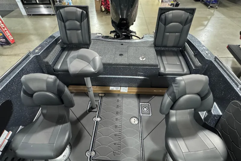 Slide: The Image of 2026 Nitro ZV19 Sport boat interior with gray seating and fishing deck. - 9