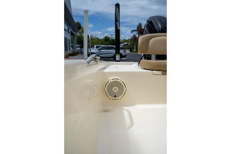 Slide: The Image of 2019 Scout 177 Sportfish Flats boat interior with speakers and seating. - 14