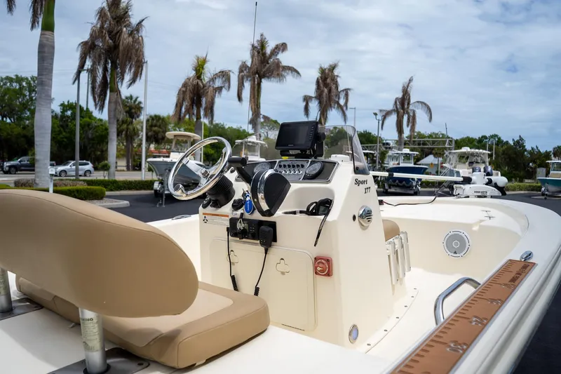 Slide: The Image of 2019 Scout 177 Sportfish Flats boat interior with steering console and seating. - 15