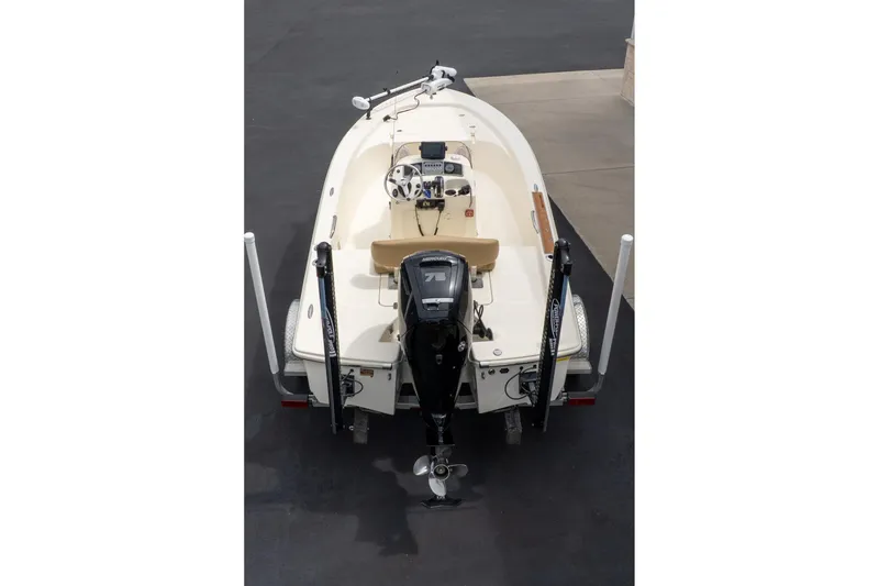 Slide: The Image of 2019 Scout 177 Sportfish Flats boat, aerial view, parked on pavement. - 17
