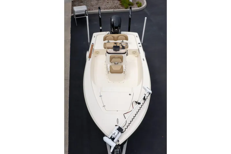 Slide: The Image of 2019 Scout 177 Sportfish Flats boat, aerial view, beige seating, trolling motor attached. - 18