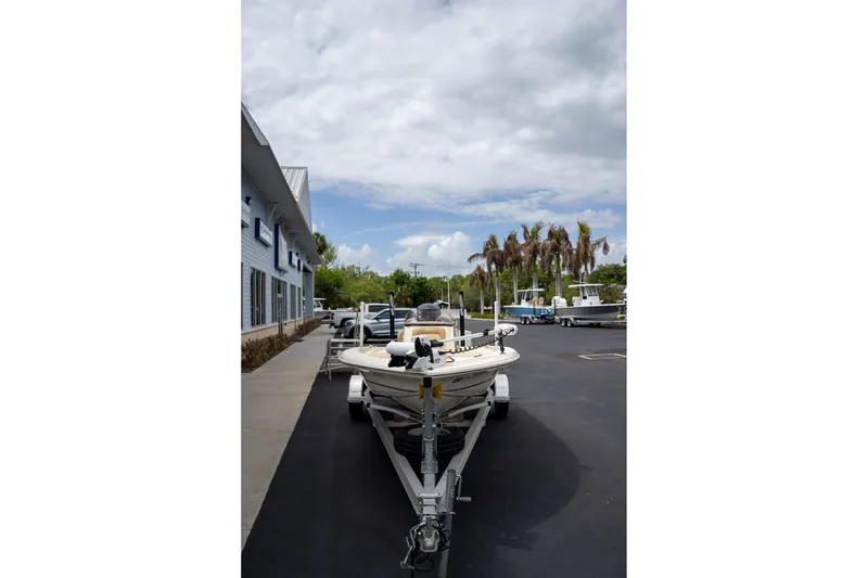 Slide: The Image of 2019 Scout 177 Sportfish Flats boat on trailer in parking lot. - 20