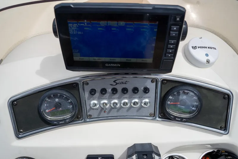 Slide: The Image of Dashboard of a 2019 Scout 177 Sportfish Flats boat with Garmin and Minn Kota devices. - 23