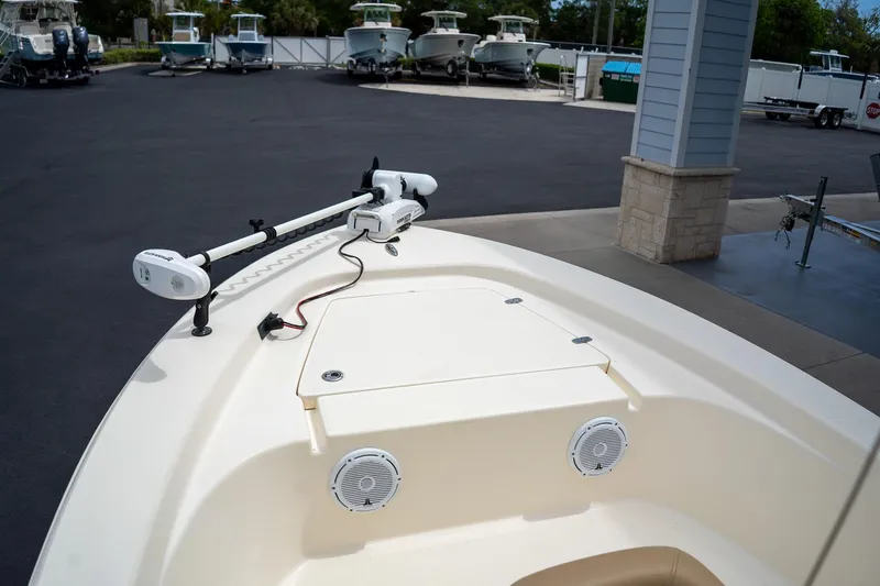 Slide: The Image of 2019 Scout 177 Sportfish Flats boat with trolling motor and speakers on deck. - 24