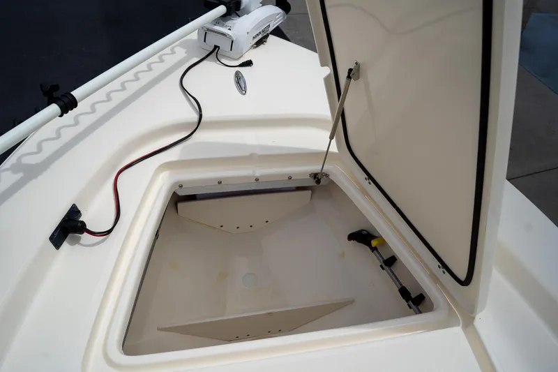 Slide: The Image of Open storage compartment on 2019 Scout 177 Sportfish Flats boat deck. - 25