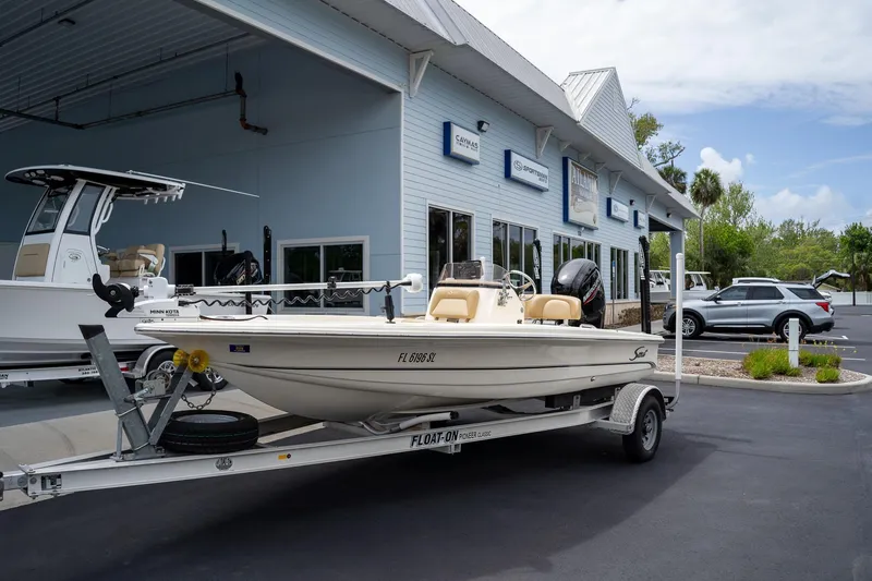 Slide: The Image of 2019 Scout 177 Sportfish Flats boat on trailer outside dealership. - 3